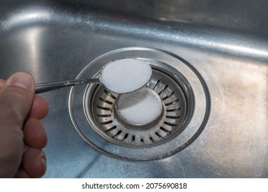 put salt into sink wot repair lines - Shutterstock ID 2075690818
