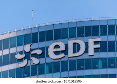Puteaux, France - November 12, 2020: Logo at the top of the EDF tower in Paris-La Defense. EDF (Electricité de France) is the historical supplier of French electricity