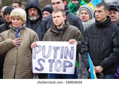 Putin Stop Sign. Demonstration Against Russian Intervention In Ukraine And Separation Of Crimea. MARIUPOL,UKRAINE - 9 March, 2014