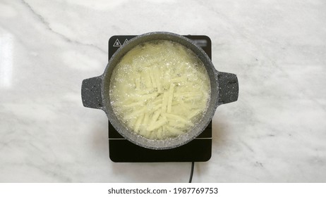 Puting Pasta In Boiling Water, Top View