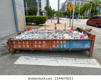 Putrajaya, Malaysia - 07 April 2022: Industrial Garbage Bin Construction Debris Container Filled With Bricks. 