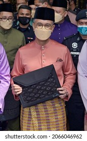 Putrajaya, Malaysia - October 29, 2021 Finance Minister Tengku Zafrul  Aziz holds a briefcase containing the 2022 budget speech outside the Finance Ministry building.