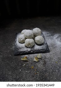 Putri Salju Or Snow Princess White Ball Cookies Is One Of Indonesian Famous Snacks For Celebrated Eid Fitr Or Eid Mubarak Or Idul Fitri . Dark Mood , Isolated, Selective Focus.