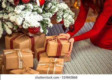 Putting Christmas Presents Under A Tree