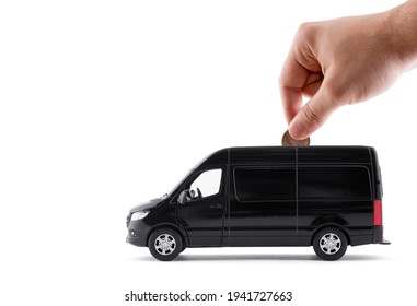 Putting coin into the transport black van car on white background