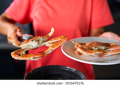 Putting Cooked Blue Crab On White Plate.