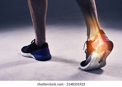 Putting an end to his run. Cropped shot of a young man in the studio with cgi highlighting his ankle injury.