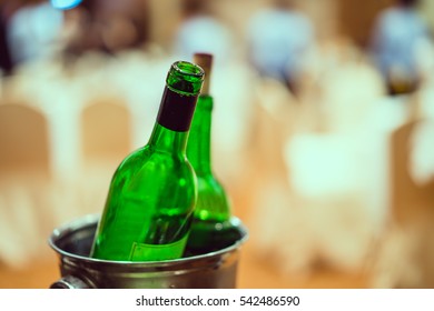 Putting green bottle in an ice bucket in congrate party. - Powered by Shutterstock