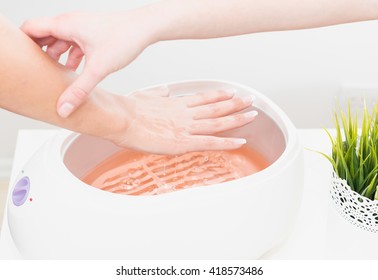 Putting Hand In Paraffin Wax Bath