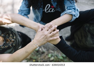  putting hands in stack
