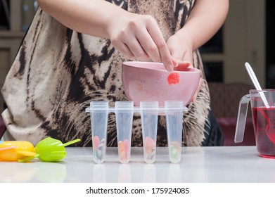 Putting Jelly Into Ice Pop Mold