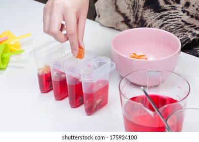 Putting Jelly Into Ice Pop Mold