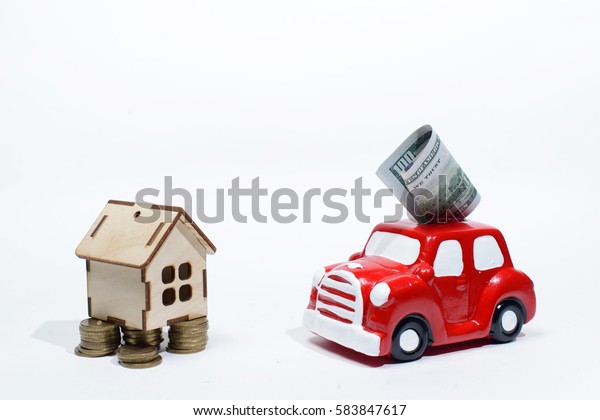 Putting Money in Car
Shaped Piggy Bank