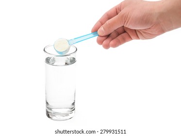 putting powdered milk into a glass cup with clipping path