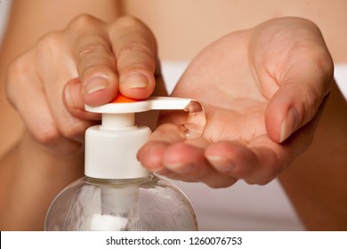 Putting Sanitizer On Hand From The Pump