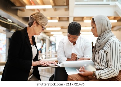 Putting Their Heads Together Over Some Business Reports