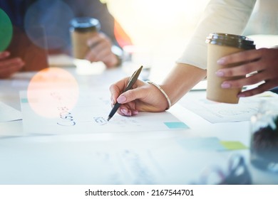 Putting In The Time To Do Proper Planning. Cropped Shot Of Unrecognizable Businesspeople Working Together In An Office.