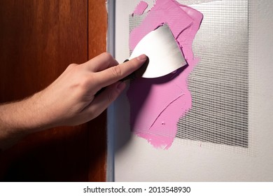 Putty Knife Application Of Spackling Compound Or Damaged Drywall Patch