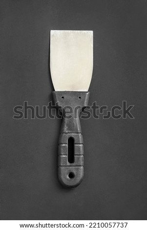 Old butcher’s hatchet on a black wooden table