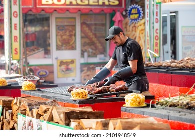 Puyallup, Washington, United States - 09-13-2021: A View Of A Pit Master Preparing The Grill At A Food Vendor, Seen At The Washington State Fair.