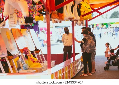 Puyallup, Washington, United States - 09-13-2021: A View Of People Enjoying The Carnival Games, Seen At The Washington State Fair.