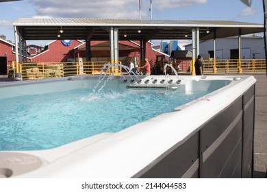 Puyallup, Washington, United States - 09-13-2021: A View Of A Hot Tub With Fountain Jets, On Display At A Fair Vendor Tent.