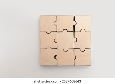 Puzzle of 9 nine wooden pieces with copy space for text, isolated on white background, panorama.  top  view.  - Powered by Shutterstock