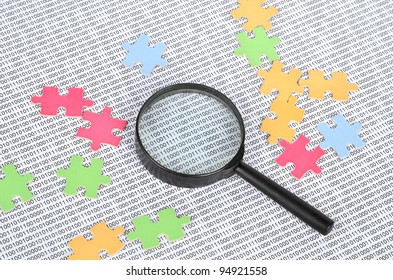Puzzle and binary code with magnifier - Powered by Shutterstock - Get 15% off with code: PIKWIZARD15