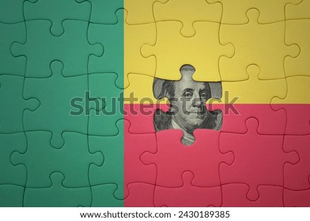 puzzle with the colourful national flag of benin and usa dollar banknote. finance concept