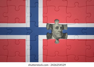 puzzle with the colourful national flag of norway and usa dollar banknote. finance concept
