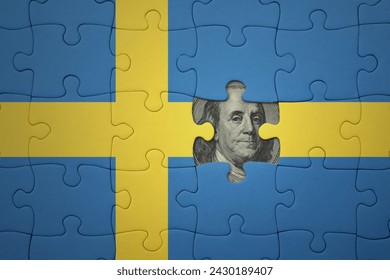 puzzle with the colourful national flag of sweden and usa dollar banknote. finance concept