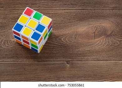 Puzzle cube on a wooden background