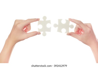 puzzle in hand isolated on white background - Shutterstock ID 392412979