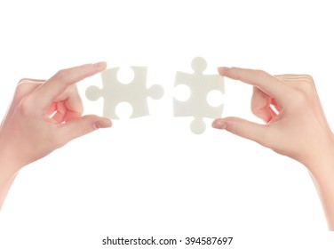 puzzle in hand isolated on white background - Shutterstock ID 394587697
