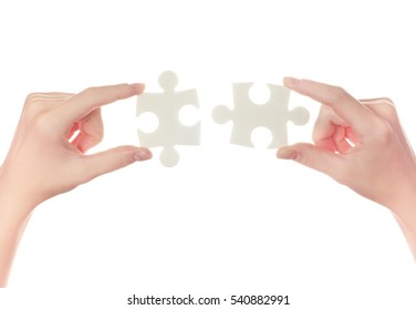 puzzle in hand isolated on white background - Shutterstock ID 540882991