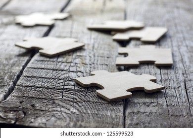 Puzzle on wooden boards team business concept