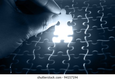 puzzle piece down into place - Shutterstock ID 94157194