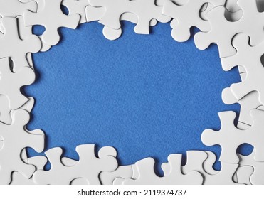 Puzzle pieces making a border frame - Powered by Shutterstock