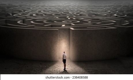 Puzzled businesswoman standing near entrance of labyrinth - Shutterstock ID 238408588