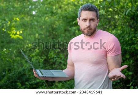 puzzled freelancer man work online. photo of freelancer man freelancing. freelancer man