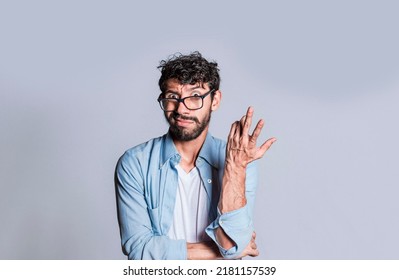 Puzzled man gesturing with one hand, Person with puzzled face frowning, Close up of puzzled people gesturing with hands.