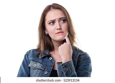 Puzzled Young Woman In Jeans Jacket