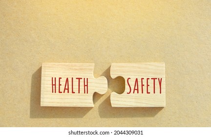 Puzzles With The Word Health And Safety. Occupational Health And Safety Systems, Protect Employees. Safe Workplace Which Uses Safe Plant And Equipment. Successful Business Concept.