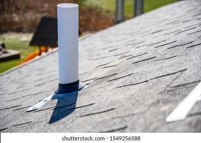PVC chimney exhaust with boot on  asphalt roof