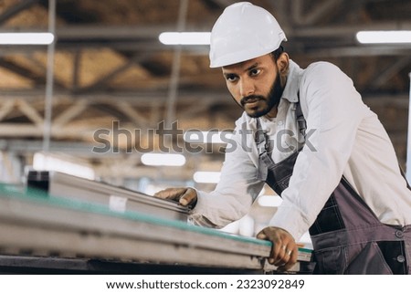 PVC industry worker making PVC frames for windows and doors