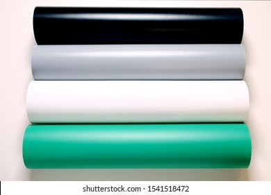 PVC Matte Reflective Dual Side Photography Backdrop Background Paper. Four rolls in a row black, gray, white and green colors.