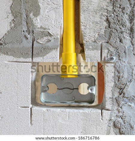 PVC pipe for electrical boxes and wires buried in walls to block.