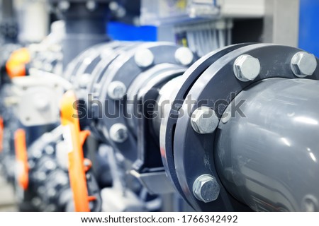 PVC pipeline an industrial city water treatment boiler room. Valves and pipe conections.