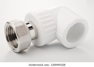 Pvc polypropylene- metallic pipe fitting on white