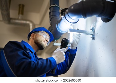 PVC Water Pipe Inspection By Construction Worker - Powered by Shutterstock